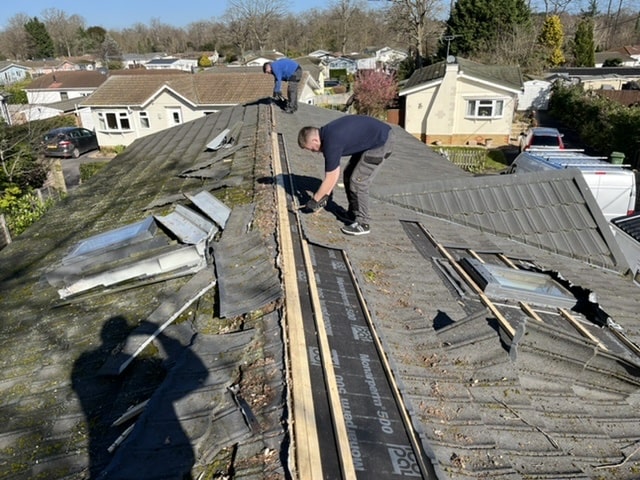 before old-roof-tiles-being-removed-min